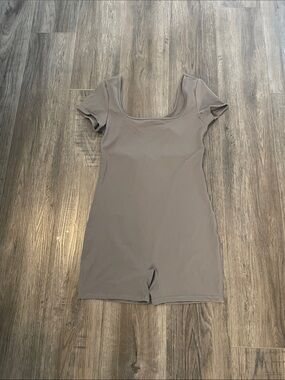 Romper with a cut out back size large